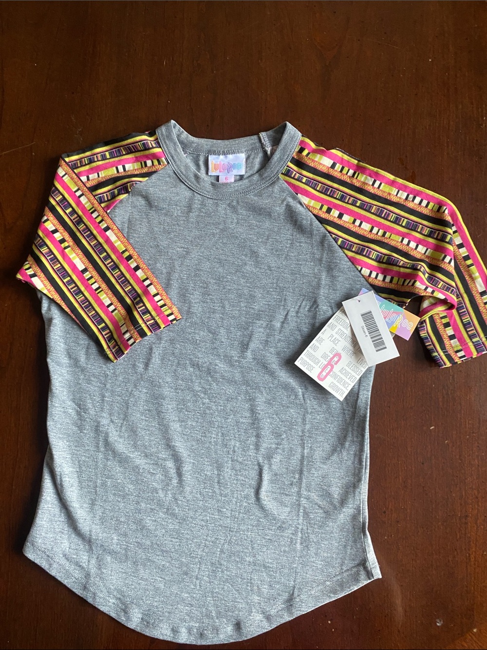 LuLaRoe Gray Tee with Yellow Pink and Black Striped Sleeves